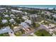 Captivating aerial view of a coastal neighborhood with lush landscaping and stunning ocean views at 580 Russell St, Longboat Key, FL 34228