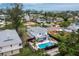 Aerial view featuring a private pool and outdoor seating of this pristine home surrounded by lush landscaping at 580 Russell St, Longboat Key, FL 34228