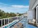 Relaxing balcony with a blue outdoor rug and views of the pool and landscape at 580 Russell St, Longboat Key, FL 34228