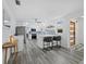 Modern, well-lit kitchen with stainless appliances, white cabinets, and a beautiful backsplash at 580 Russell St, Longboat Key, FL 34228