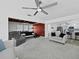 Spacious living area with neutral tones, fireplace, and an open floor plan leading to the kitchen at 580 Russell St, Longboat Key, FL 34228