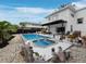 Gorgeous pool and spa with rock features, lush landscaping, and a spacious deck for entertaining at 580 Russell St, Longboat Key, FL 34228