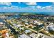 Waterfront living is exemplified in this home with canal access to Tampa Bay and lush tropical landscaping at 602 Baronet Ln, Holmes Beach, FL 34217