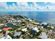 Gorgeous aerial view of waterfront home, showcasing prime location and stunning scenic views of bay at 602 Baronet Ln, Holmes Beach, FL 34217