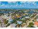 Enjoy stunning waterfront views from this home with direct canal access and lush tropical landscaping at 602 Baronet Ln, Holmes Beach, FL 34217