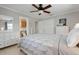 Comfortable bedroom boasts tile flooring, neutral paint, and updated furnishings at 602 Baronet Ln, Holmes Beach, FL 34217