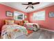 Bedroom features wood flooring, neutral paint and two twin beds at 602 Baronet Ln, Holmes Beach, FL 34217