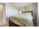 Comfortable bedroom offering a closet, queen bed and calm decor at 602 Baronet Ln, Holmes Beach, FL 34217