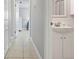 Hallway with a small, white sink and multiple doorways at 602 Baronet Ln, Holmes Beach, FL 34217