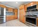 Functional kitchen featuring stainless steel appliances, ample cabinetry, and a mosaic backsplash at 602 Baronet Ln, Holmes Beach, FL 34217