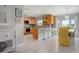 Bright kitchen with stainless steel appliances, ample counter space, and adjacent dining area at 602 Baronet Ln, Holmes Beach, FL 34217
