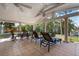 Covered patio with comfortable seating and relaxing views of the outdoor space at 602 Baronet Ln, Holmes Beach, FL 34217