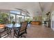 Spacious covered patio with ample seating, ceiling fans, and access to the outdoors at 602 Baronet Ln, Holmes Beach, FL 34217