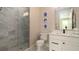 Elegant bathroom featuring marble shower, vanity, modern fixtures, and neutral wall colors for a calming spa-like feel at 603 Emerald Ln, Holmes Beach, FL 34217