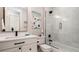 Bathroom featuring a white vanity with black hardware and a glass-enclosed shower with rainfall showerhead at 603 Emerald Ln, Holmes Beach, FL 34217