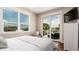 This comfortable bedroom boasts a sliding glass door leading to the outdoor living area at 603 Emerald Ln, Holmes Beach, FL 34217