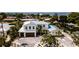 Beautiful two-story home with a spacious driveway and lush landscaping, offering curb appeal and comfort at 603 Emerald Ln, Holmes Beach, FL 34217