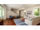 Bright living room with hardwood floors, stylish furniture, and staircase access at 603 Emerald Ln, Holmes Beach, FL 34217