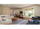 Comfortable living room with hardwood floors, modern decor, and open access to the dining area at 603 Emerald Ln, Holmes Beach, FL 34217
