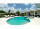Refreshing pool and spa area surrounded by lush tropical greenery, perfect for relaxation at 603 Emerald Ln, Holmes Beach, FL 34217