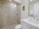 Bathroom with walk-in glass shower, tile, and clean vanity with sink at 6512 Midnight Pass Rd # 303, Sarasota, FL 34242
