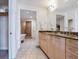 Luxurious bathroom with dual sinks, marble countertops, and walk-in shower at 6512 Midnight Pass Rd # 303, Sarasota, FL 34242