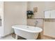 Elegant bathroom featuring a freestanding tub with stylish fixtures and tiled surround at 6512 Midnight Pass Rd # 303, Sarasota, FL 34242