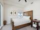 Cozy bedroom with carpet, and wooden furniture and decorations at 6512 Midnight Pass Rd # 303, Sarasota, FL 34242