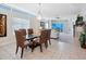 Bright dining room features a modern glass table, stylish leather chairs, and contemporary decor at 6512 Midnight Pass Rd # 303, Sarasota, FL 34242
