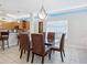 Bright dining room features a modern glass table, stylish leather chairs, and an open floor plan at 6512 Midnight Pass Rd # 303, Sarasota, FL 34242