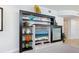 Contemporary entertainment center with a display for decor and a built in TV at 6512 Midnight Pass Rd # 303, Sarasota, FL 34242