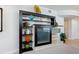 Contemporary entertainment center with display space and a modern, built-in design at 6512 Midnight Pass Rd # 303, Sarasota, FL 34242