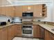 Well-equipped kitchen with stainless steel appliances and granite countertops at 6512 Midnight Pass Rd # 303, Sarasota, FL 34242