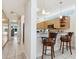 Bright, modern kitchen with granite countertops and breakfast bar seating at 6512 Midnight Pass Rd # 303, Sarasota, FL 34242