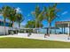 Modern park and beach access with grassy lawn and covered benches at 6512 Midnight Pass Rd # 303, Sarasota, FL 34242