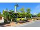 Charming yellow and green restaurant with outdoor seating and lush trees at 6512 Midnight Pass Rd # 303, Sarasota, FL 34242