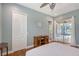 This bright bedroom offers private access to the lanai, hardwood floors, and generous closet space at 6539 Flycatcher Ln, Lakewood Ranch, FL 34202
