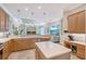 Open kitchen featuring a breakfast bar, stainless steel appliances, and seamless connection to the living room at 6539 Flycatcher Ln, Lakewood Ranch, FL 34202