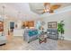 Spacious living room showcasing a modern design with tile flooring and neutral walls at 6539 Flycatcher Ln, Lakewood Ranch, FL 34202