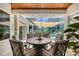 Relax on the covered patio with comfortable seating and a view of the pool at 6539 Flycatcher Ln, Lakewood Ranch, FL 34202