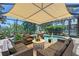 Screened in patio and pool area with outdoor seating perfect for entertaining at 6539 Flycatcher Ln, Lakewood Ranch, FL 34202