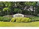 Landscaped entrance to Greenbrook Village community with stone wall sign at 6539 Flycatcher Ln, Lakewood Ranch, FL 34202