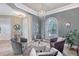 Inviting sitting room with natural light, comfortable seating, and elegant chandelier at 6539 Flycatcher Ln, Lakewood Ranch, FL 34202
