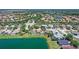 Real estate aerial view of a house in a beautiful neighborhood with a pond at 6605 38Th E Ln, Sarasota, FL 34243