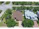 Beautiful aerial view of a well-maintained home with a screened-in pool and lush landscaping at 6605 38Th E Ln, Sarasota, FL 34243