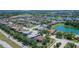 Aerial view of home in a lakeside community with mature trees and landscaping at 6605 38Th E Ln, Sarasota, FL 34243