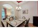 Dining room featuring decorative table and archway leading into the living room at 6605 38Th E Ln, Sarasota, FL 34243