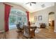 Bright living room featuring vaulted ceilings, hardwood floors and a sliding door to the lanai at 6605 38Th E Ln, Sarasota, FL 34243