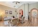 Spacious living room with high ceilings, hardwood floors, and comfortable seating arrangement at 6605 38Th E Ln, Sarasota, FL 34243
