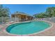 Community pool and amenity area featuring an open-air pavilion for shaded relaxation at 6605 38Th E Ln, Sarasota, FL 34243